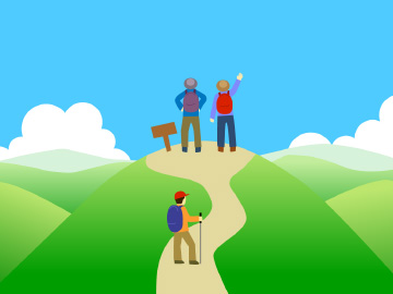 山の頂上に向かうハイカー